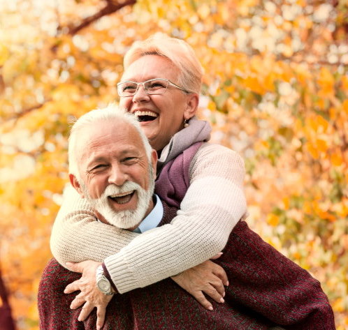 Happy senior couple with healthy white smile